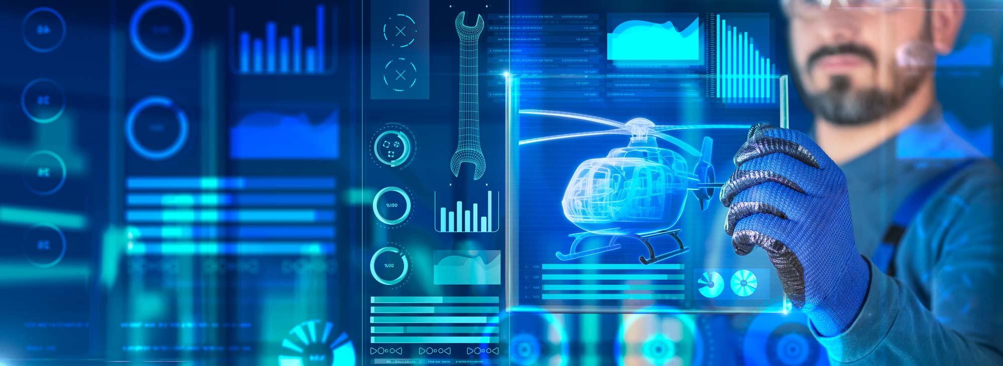 Man holding up glass tablet with helicopter schematic on it
